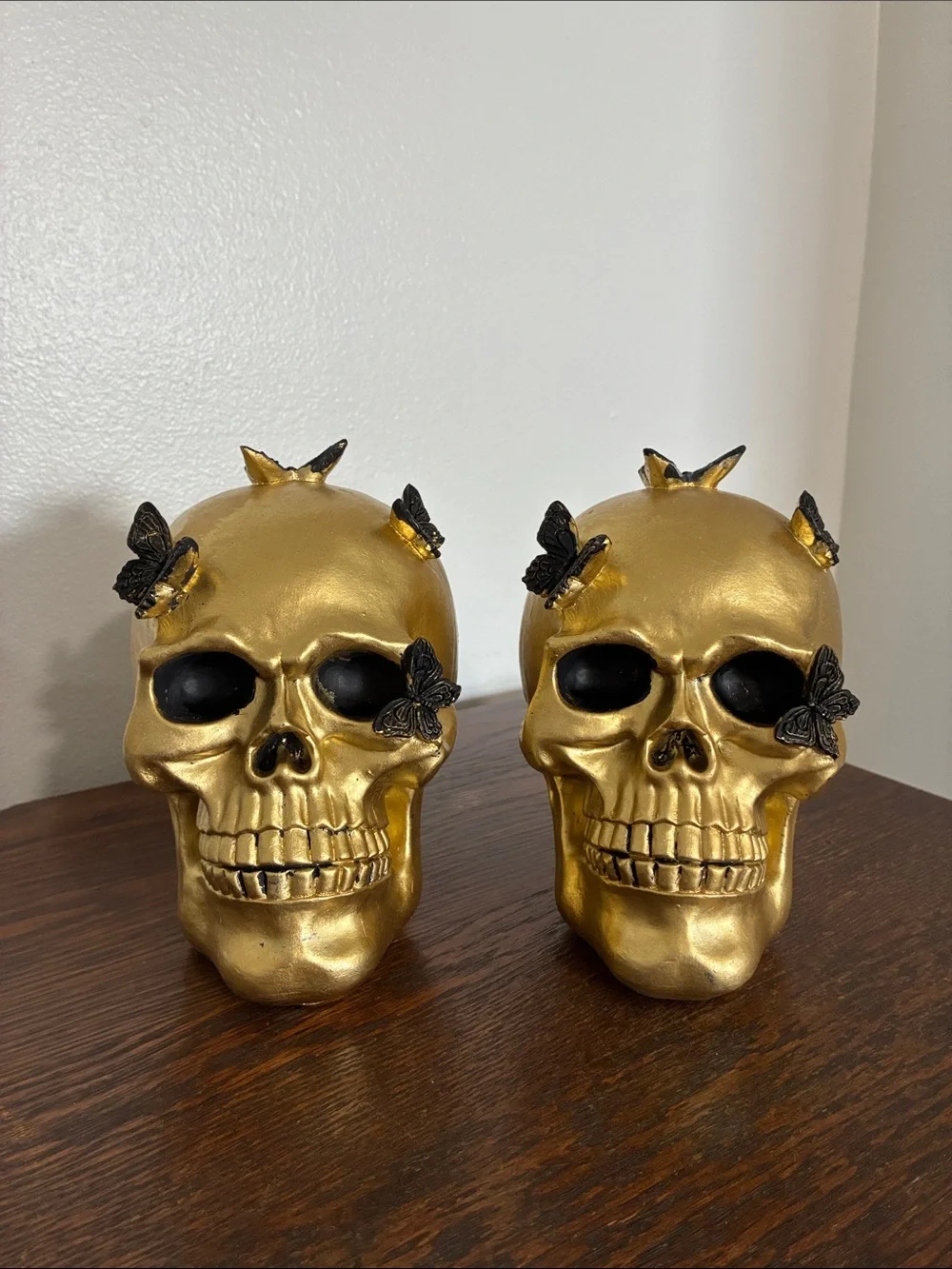 NWT- Set of 2- STUNNING- Gold Skull Statues with Black Butterflies Accents